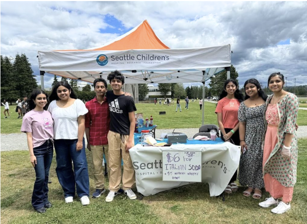 People standing next to a booth